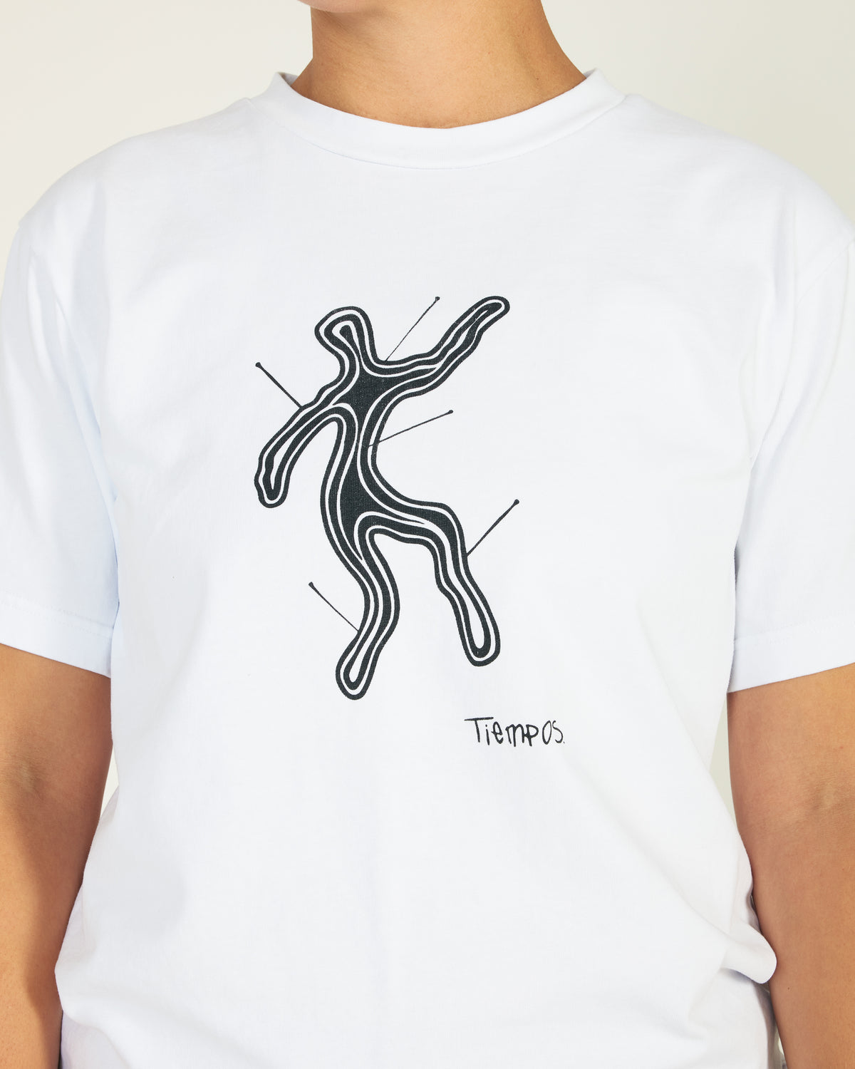 White t-shirt with black abstract design and 'Tiempo' text on a plain background