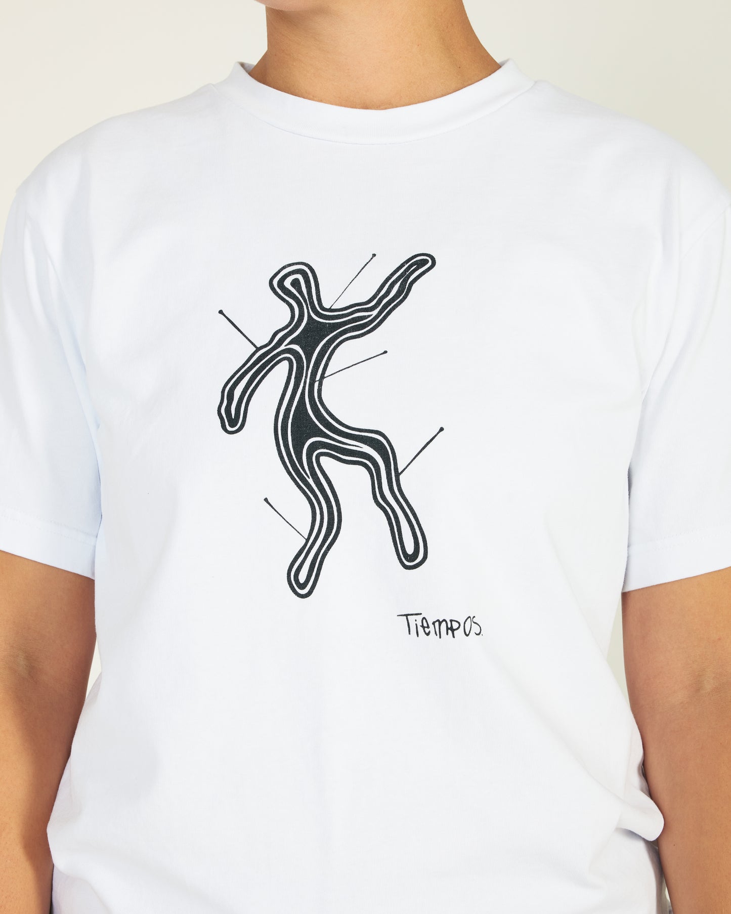 White t-shirt with black abstract design and 'Tiempo' text on a plain background